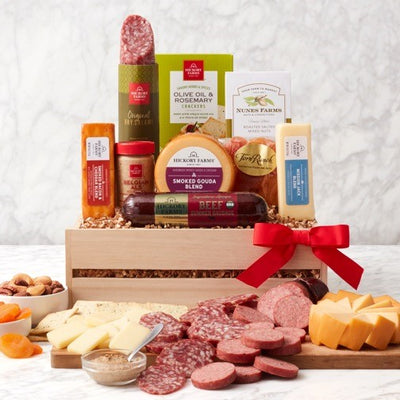 Wooden gift crate with summer sausage, salami, cheeses, mustard, crackers, nuts and dried fruit