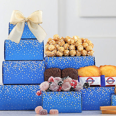 Colorful gourmet gift tower with fruit jellies, brownies, caramels, fudge, cakes and caramel popcorn